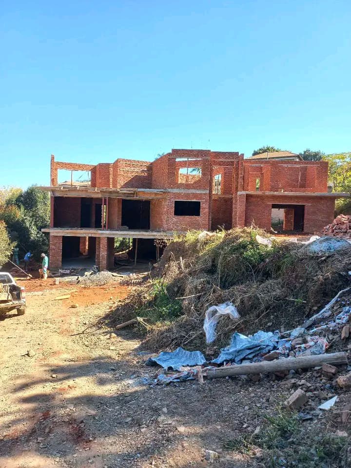 Double-storey brick house under construction by Fanuel Chakanyuka Construction